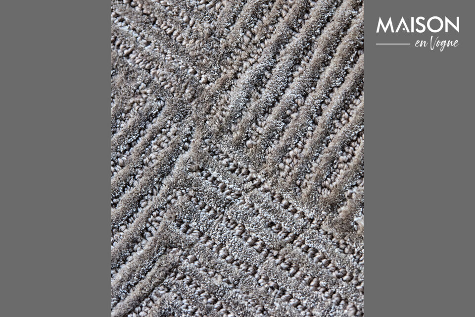 Ce tapis fait main apporte une élégance discrète et une touche subtile de luxe à n\'importe quel