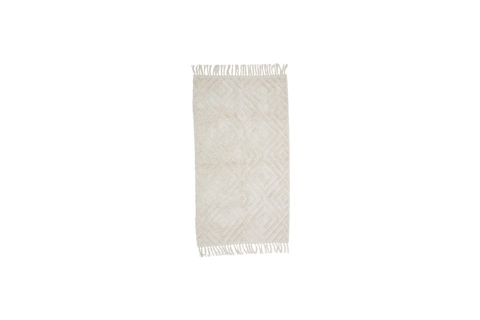 Le tapis Lenna de Bloomingville est 100 % coton et présente un magnifique motif tufté dans un ton