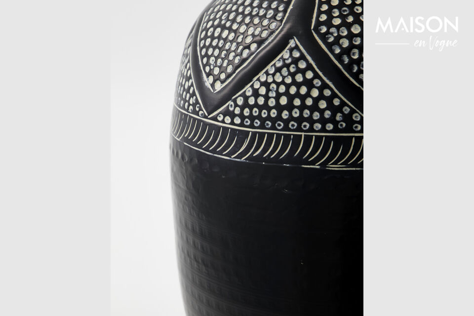 This handmade vase is a true work of art, crafted from a unique blend of aluminium and iron