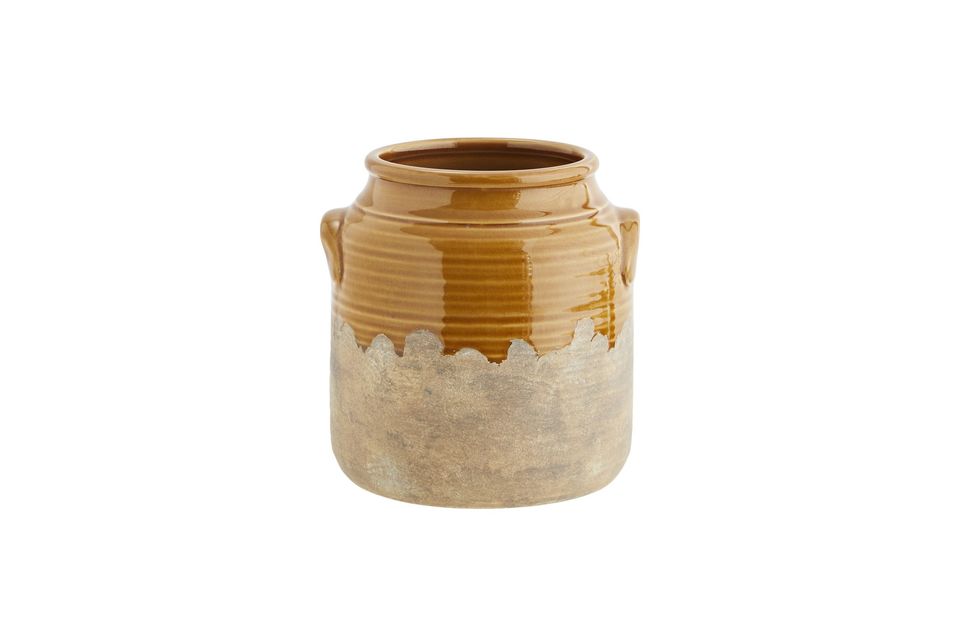 Ce vase en grès ressemble à un ancien pot alimentaire ce qui lui donne un petit côté rétro