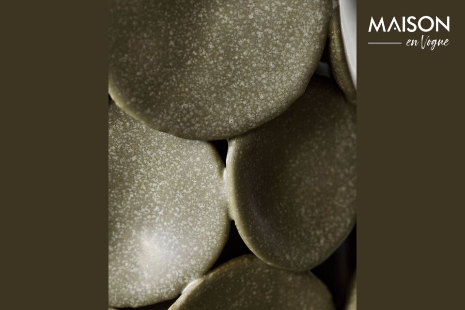 The matte surface and artistic details bring depth and character to any table, shelf, or console