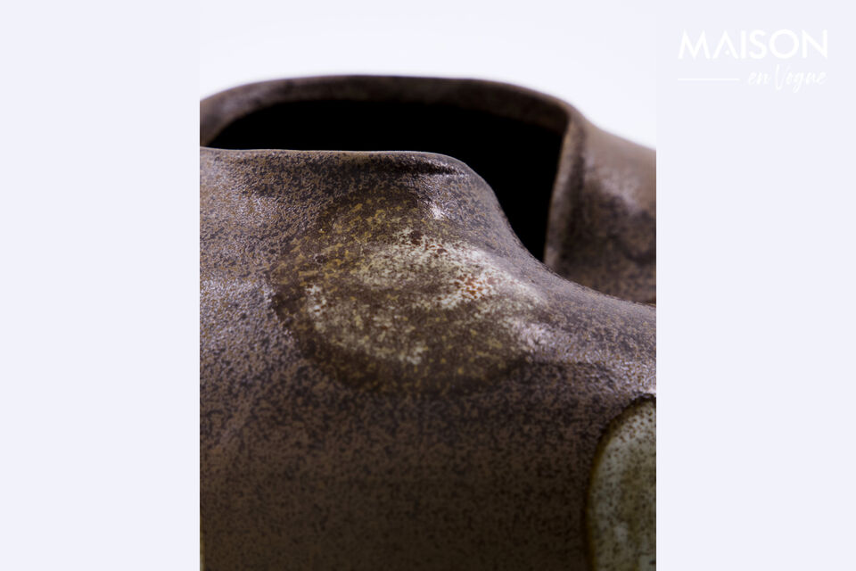 Bring a modern bohemian vibe to your home with this handmade stoneware vase