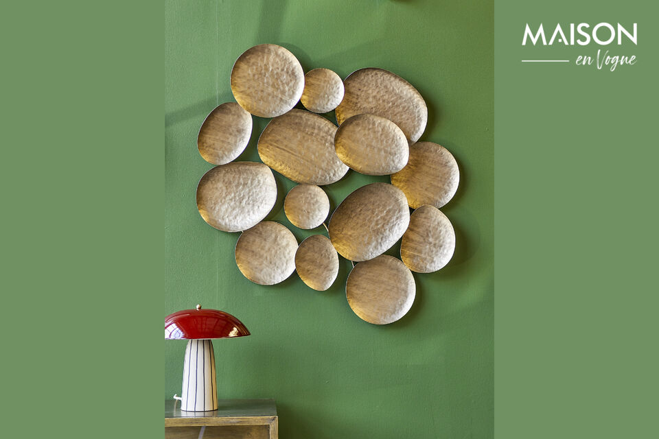 The Raynee Wall Decor by Bloomingville is a sculptural wall piece in a warm brass color