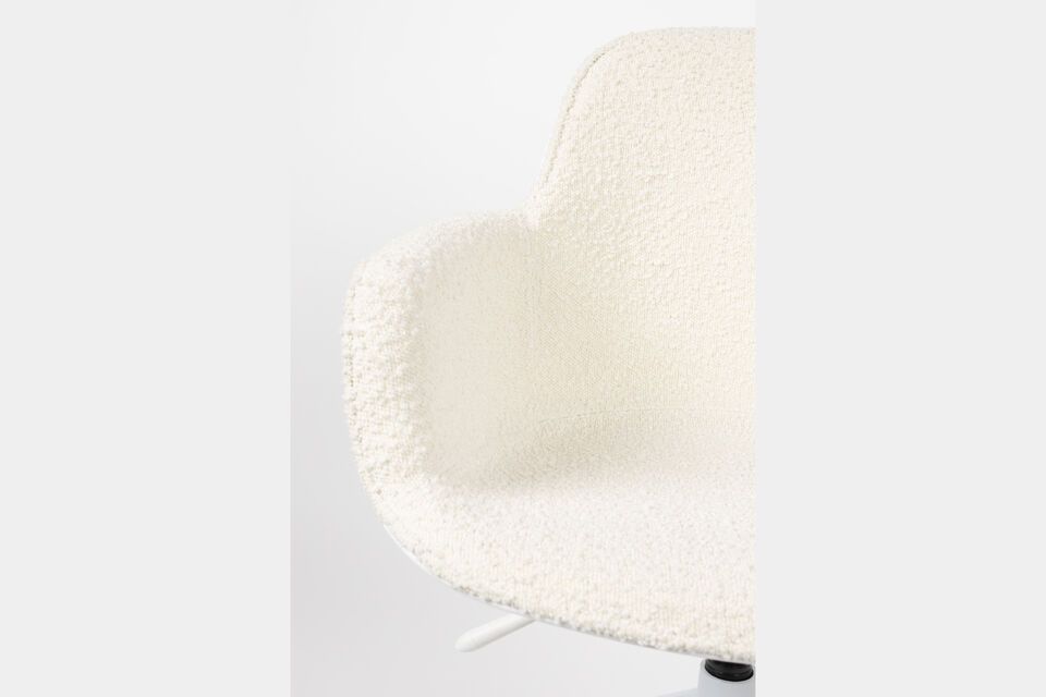 Its seat is padded and upholstered, allowing you to work for hours without discomfort