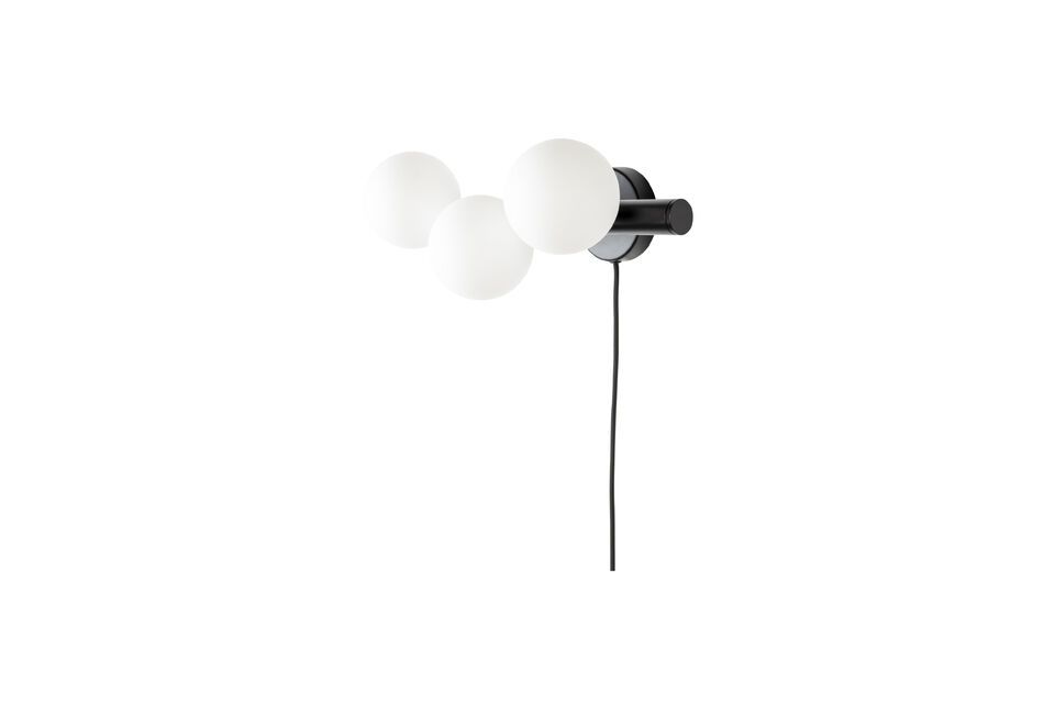 The black color of the Monica wall light adds a striking contrast