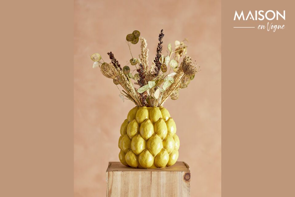 Made from high-quality stoneware and adorned in a warm yellow color